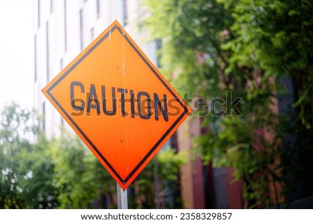 Pedestrian crossing sign under construction with orange color