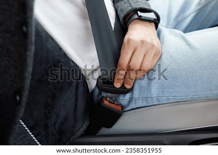 Man Hand Fastening Car Safety Seat Belt. Protection Road Safety Snap Driving. Driver Fastening Seatbelt In Car. Man Car Lap Buckling Seat Belt Inside In Vehicle Before Driving. Royalty-Free Stock Photo #2358351955