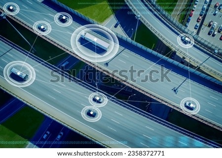 Satellite car navigation. Cars are driving along road. Large road junction. Lines connect moving cars. Concept satellite navigation tech. Tracking vehicles from satellite. Use navigation technologies
