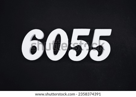 Black for the background. The number 6055 is made of white painted wood.
