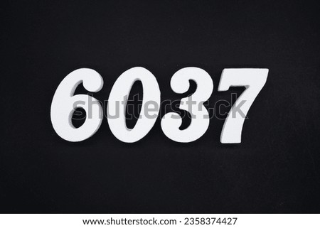 Black for the background. The number 6037 is made of white painted wood.