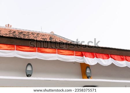 an additional building (pendopo) with Indonesian flags lined up in Besuki square, Situbondo