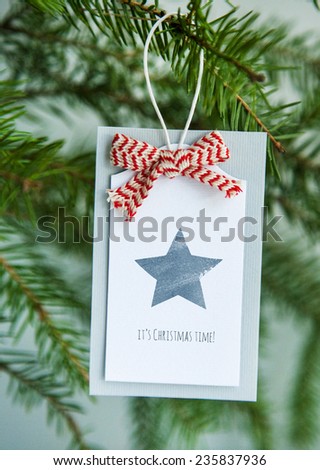 Vintage Christmas tag with ribbon and typewriter MERRY CHRISTMAS AND HAPPY NEW YEAR