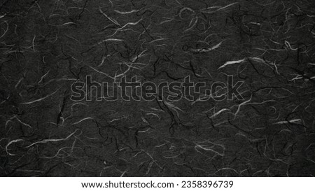 Abstract colour black Japanese paper handmade texture for the background.
Dark grey Korean paper mulberry craft pattern seamless. 
Top view.