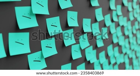 Many teal stickers on black board background with confused smile symbol drawn on them. Closeup view with narrow depth of field and selective focus