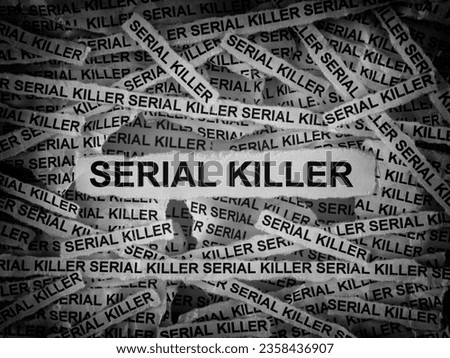 Strips of newspaper with the words Serial Killer typed on them. Black and white. Close up. Royalty-Free Stock Photo #2358436907
