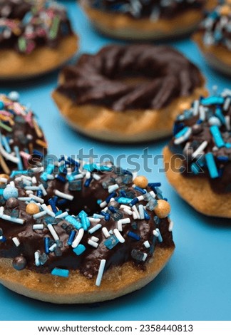 Sweet donuts with chocolate and small candies