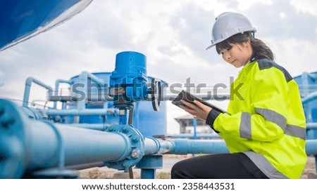 Environmental engineers work at wastewater treatment plants,Water supply engineering working at Water recycling plant for reuse,Check the amount of chlorine in the water to be within the criteria. Royalty-Free Stock Photo #2358443531