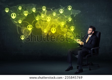 Businessman in office with tablet and social network world map concept on background