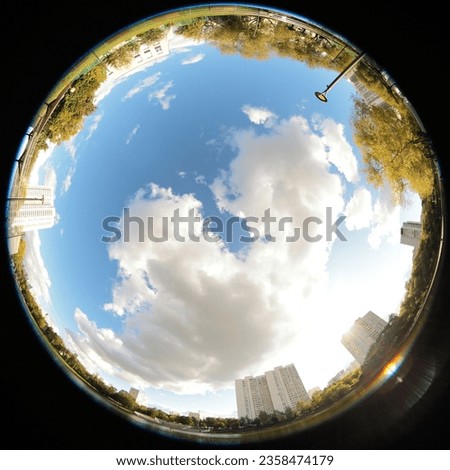 Around on Sky. Taken with a fisheye lens to give the special plate effect. Urban environment. The fresh air feel and clear blue sky are shown on the picture. Main focus.
