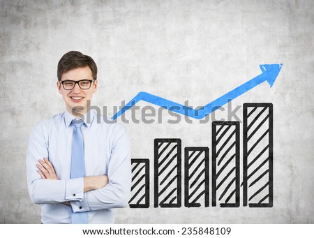 happy businessman and drawing profit on wall
