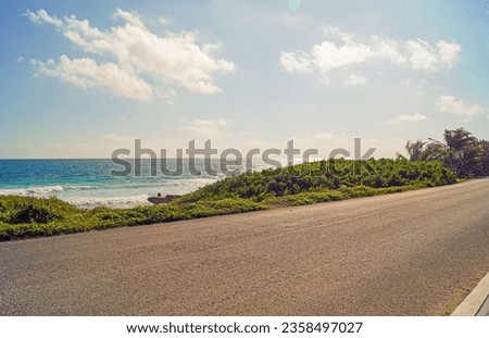 Beach road on Isla mujeres in Mexico with the Caribbean Sea in the background Royalty-Free Stock Photo #2358497027