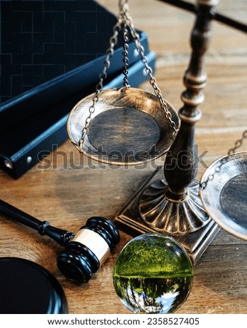 Environment Law International Law and. law for global economic regulation aligned with the principles of sustainable environmental conservation. Green World and gavel with scales of justice and books. Royalty-Free Stock Photo #2358527405