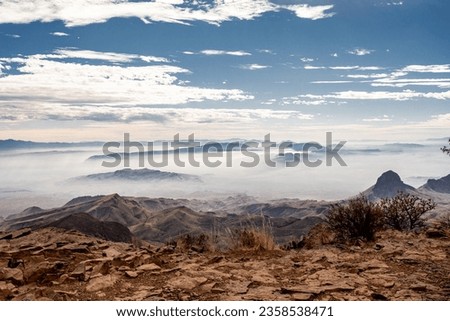 Fog Gathering Over the Edge of the South Rim Trail in Big Bend National Park Royalty-Free Stock Photo #2358538471