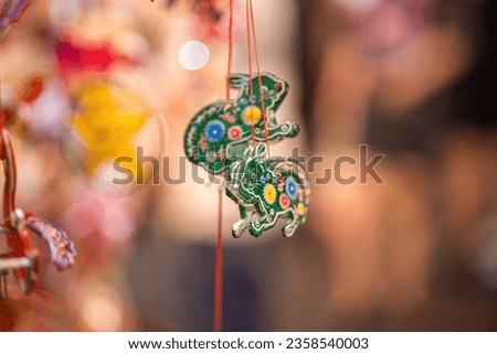 Blurred background beautiful lantern. Decorated colorful lanterns hanging on a stand in the streets in Ho Chi Minh City, Vietnam during Mid Autumn Festival. Chinese language in photos mean happiness