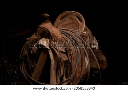 A well used western saddle at a museum in Central Oregon Royalty-Free Stock Photo #2358553843