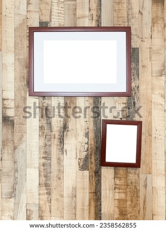 Close up of picture frame on wooden wall background use for something display.