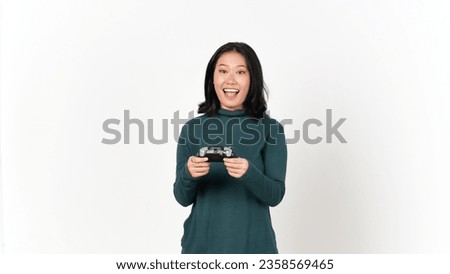 Holding Game Controller and Playing, Yes and Happy face gesture Of Beautiful Asian Woman Isolated On White Background