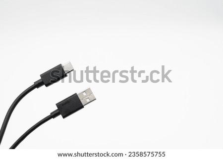 USB type A to C. Mobile data cable. Phone usb connector on white background. Isolated usb cord Charger usb cable on a white background. Royalty-Free Stock Photo #2358575755