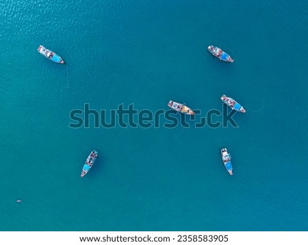 Seascape taken from above with Vietnamese fishermen's fishing boats on the turquoise water.  Sea concept, boats.