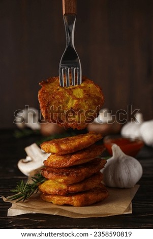 Lunch tasty food concept - delicious hash browns Royalty-Free Stock Photo #2358590819