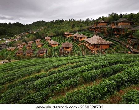 Rak Thai Village Chinese Yunnan Thai Village located in the middle of the valley Mae Hong Son Province The unique feature of this village is that there is a large lake in the middle of the village.  Royalty-Free Stock Photo #2358598703