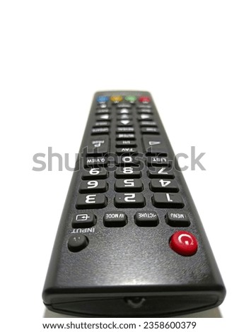 
close-up photo of black equipment remote control on white background.