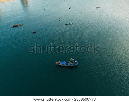 Seascape taken from above with Vietnamese fishermen's fishing boats on the turquoise water.  Sea concept, boats.