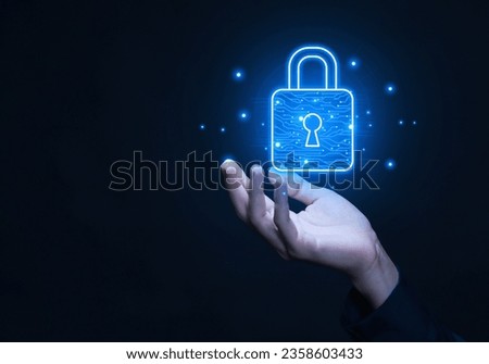 Businessman selects a lock icon on a virtual display. Internet network security concept, website connection. to prevent hackers from cyber attacks Digital technology, user privacy encryption Royalty-Free Stock Photo #2358603433