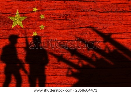 China flag on wood and soldiers shadow