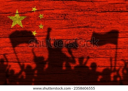 China flag painting on wood and Protesters shadow.