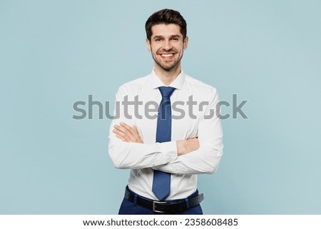 Young smiling successful employee business man corporate lawyer wear classic formal shirt tie work in office hold hands crossed folded isolated on plain pastel light blue background studio portrait Royalty-Free Stock Photo #2358608485