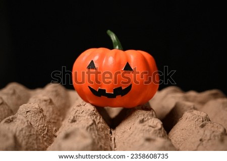 Halloween Decoration Made From Artificial Pumpkins and Paper