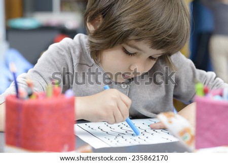 Lonely Girl drawing at kindergarten
