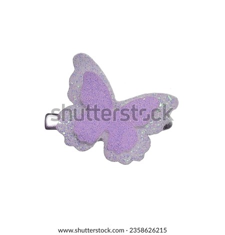 Beautiful purple and white butterfly hair clip with glitter against a white background. Royalty-Free Stock Photo #2358626215