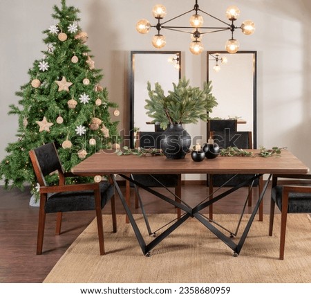 Modern dining room interior with Christmas tree and decorations. New Year concept, Large, modern, blank hanging pictures - empty mock-up portraits.