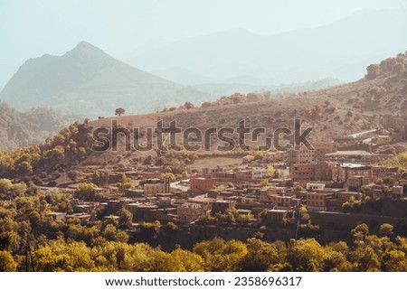 Nature, rocks, houses and mountains in Atlas Mountains Morocco  Royalty-Free Stock Photo #2358696317