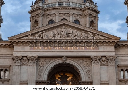 A close-up picture of the inscription on the facade of St. Stephen's Basilica at sunset, that reads as "I am the way, the truth and the life".