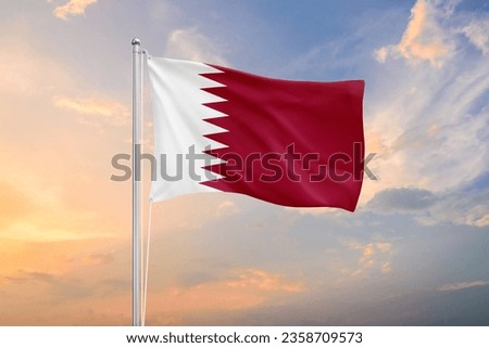 Qatar flag waving on sundown sky