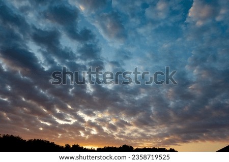 Sunrise, beautiful sky with clouds at sunrise in a city in Brazil, natural light, selective focus.