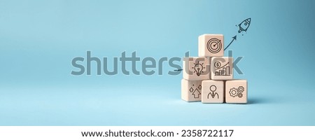 Rocket launching from wood cube with business icon, Start-up, Creativity, Big idea, Business goals management, Investment on new project to wealth, Company strategy target, Sustainable financial plan Royalty-Free Stock Photo #2358722117