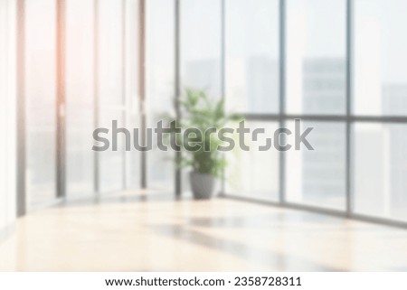 On the blurred background of the empty office room