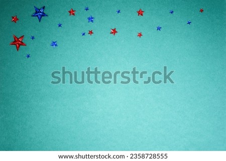 Confetti stars on paper sky background. Holiday Halloween and celebration concept.