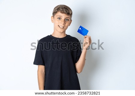 Photo of happy cheerful smiling positive beautiful kid boy wearing casual black T-shirt recommend credit card