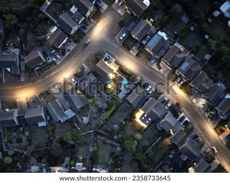 An aerial of a densely populated residential area with its main road Royalty-Free Stock Photo #2358733645