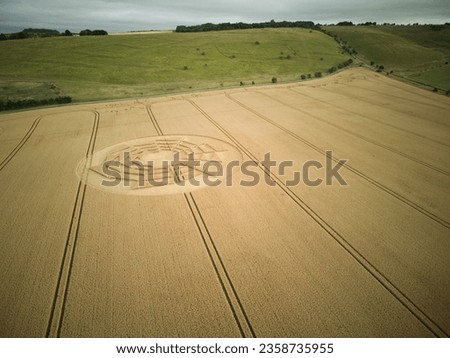 An aerial view of crop circles in a vast agricultural field in the countryside of Wiltshire, England Royalty-Free Stock Photo #2358735955