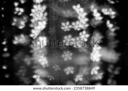 Defocus blur background, blurred light bokeh in black and white, christmas light bokeh