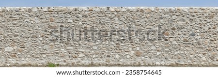 Typical rough natural stone wall in Tuscany. Can be seamlessly combined with left version to create a larger panorama. Royalty-Free Stock Photo #2358754645