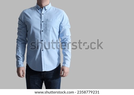 Man wearing clean shirt on white background, closeup. Space for text