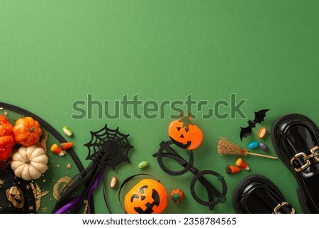 Indulge in Halloween ambiance with this enchanting overhead picture featuring witch attributes, Halloween-themed decorations on a green isolated background, ideal for text or advert placement